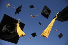 graduation-caps-thrown-in-air