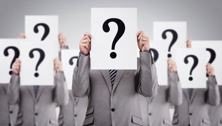 Business-colleagues-holding-question-mark-signs-000069482533_Large.jpg