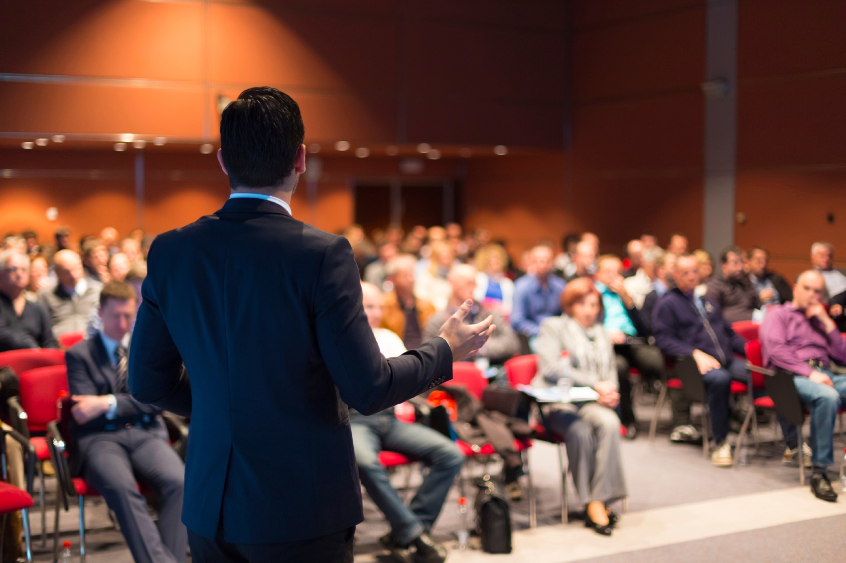 A-man-speaking-at-a-business-conference-000040536788_Medium.jpg