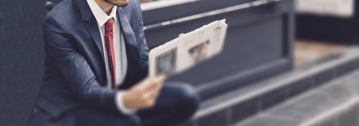 Businessman-reading-a-newspaper-000070585809_Large_cropped_again.png